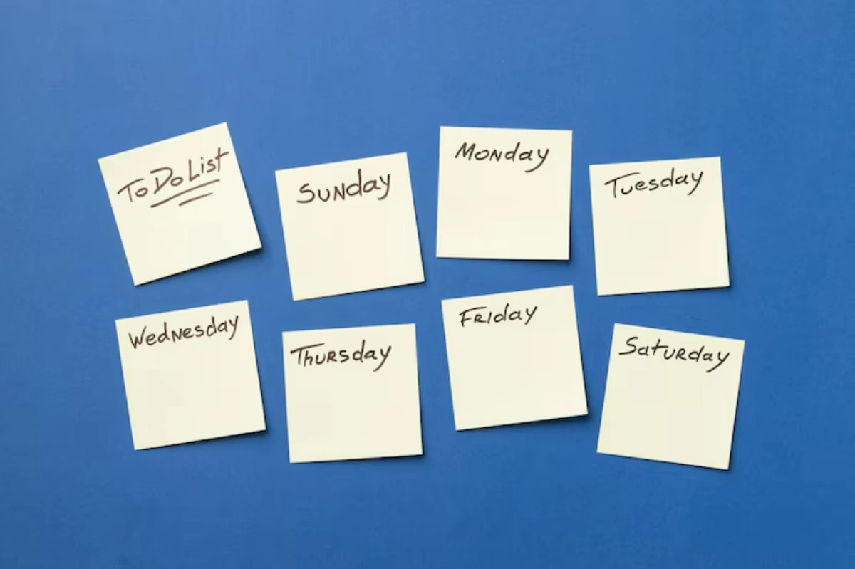 A blue background features sticky notes labeled To Do List, along with the days of the week: Sunday, Monday, Tuesday, etc.