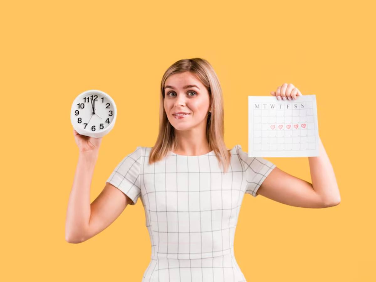 A woman holds a clock in one hand and a weekly calendar with red hearts marked on it in the other, set against a bright yellow background.