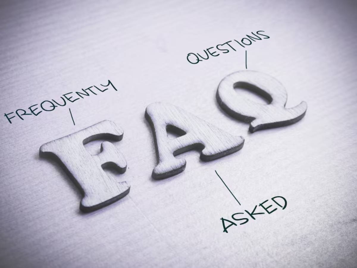 Wooden letters spelling FAQ with Frequently above and Asked below, set against a textured background.